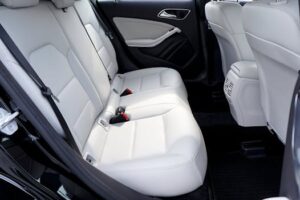 Explore the modern and luxurious feel of a car's interior with pristine white leather seats.